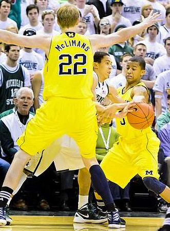 Blake McLimans (22) and Trey Burke (3)