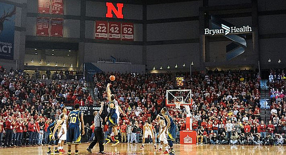 Derrick Walton Jr. (10), Jordan Morgan (52), and Caris LeVert (23)