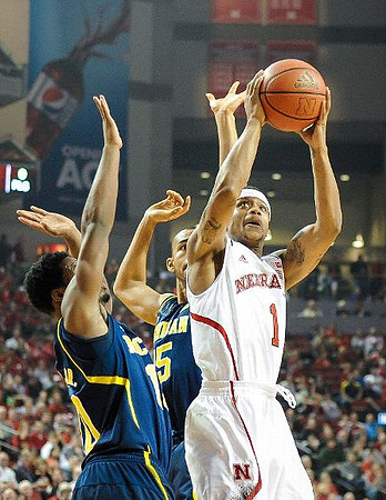 Derrick Walton Jr. (10) and Jon Horford (15)