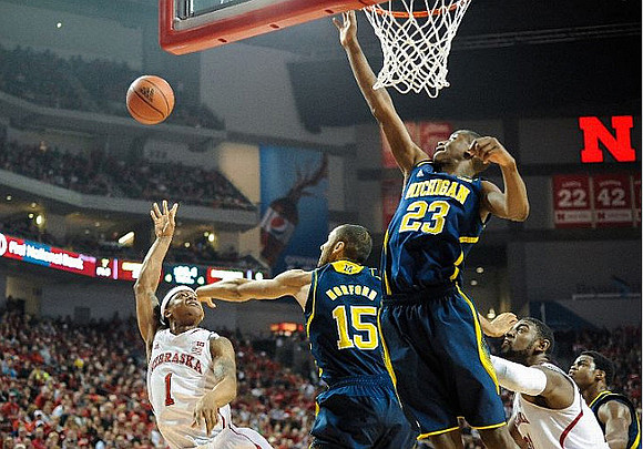 Jon Horford (15) and Caris LeVert (23)