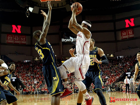Derrick Walton Jr. (10), Caris LeVert (23), Jordan Morgan (52), and Nik Stauskas (11)