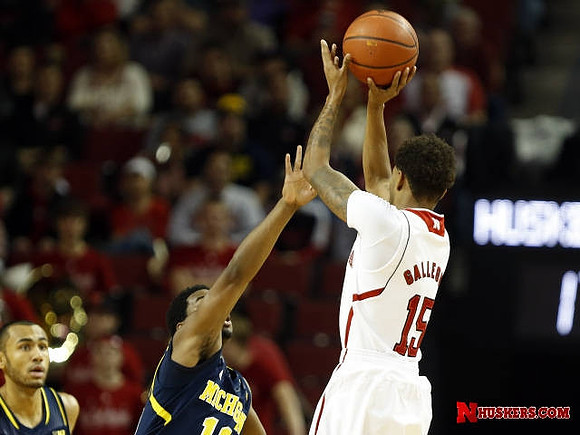 Jon Horford (15) and Derrick Walton Jr. (10)