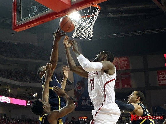 Derrick Walton Jr. (10), Caris LeVert (23), and Jordan Morgan (52)