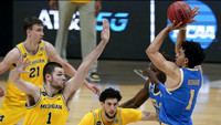 Franz Wagner (21), Hunter Dickinson (1), and Brandon Johns Jr. (23)
