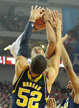Jordan Morgan (52) and Derrick Walton Jr. (10)