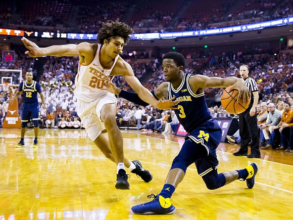 Zavier Simpson (3) and Muhammad-Ali Abdur-Rahkman (12)