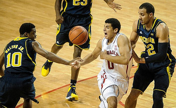 Derrick Walton Jr. (10), Caris LeVert (23), and Jordan Morgan (52)