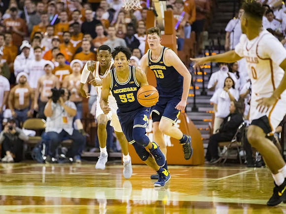 Eli Brooks (55) and Jon Teske (15)