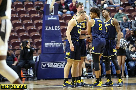 Jon Teske (15), Charles Matthews (1), Jordan Poole (2), and Ignas Brazdeikis (13)