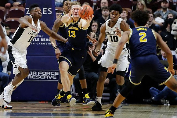 Charles Matthews (1), Jordan Poole (2), and Ignas Brazdeikis (13)