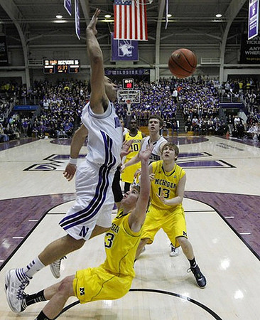Evan Smotrycz (23), Matt Vogrich (13), and Tim Hardaway Jr. (10)