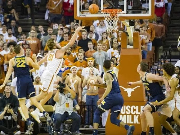 Duncan Robinson (22), Charles Matthews (1), and Jon Teske (15)