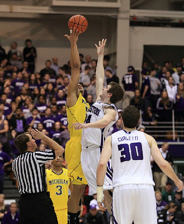 Trey Burke (3) and Jordan Morgan (52)