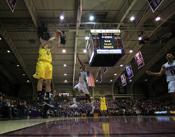 Zack Novak (0) and Trey Burke (3)