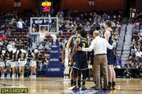 Charles Matthews (1), Zavier Simpson (3), John Beilein, and Jon Teske (15)