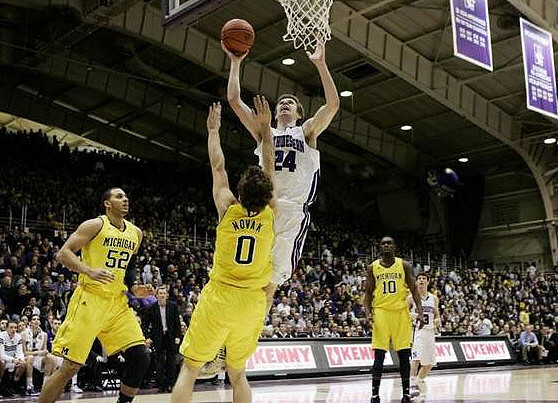 Jordan Morgan (52), Zack Novak (0), and Tim Hardaway Jr. (10)