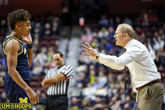 Jordan Poole (2) and John Beilein