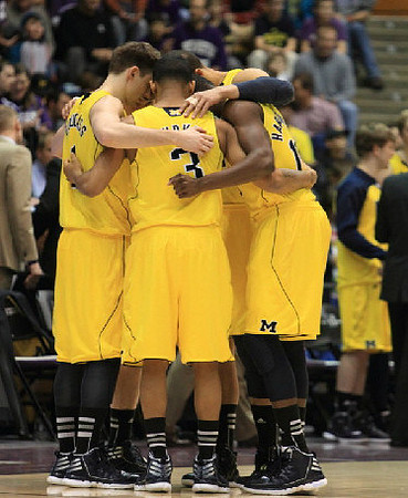 Stu Douglass (1), Trey Burke (3), Tim Hardaway Jr. (10), and Jordan Morgan (52)