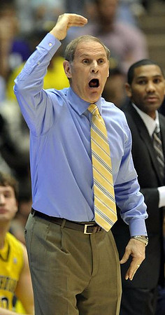Zack Novak (0), John Beilein, and LaVall Jordan