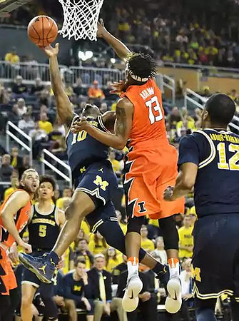 D.J. Wilson (5), Derrick Walton Jr. (10), and Muhammad-Ali Abdur-Rahkman (12)