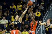 Xavier Simpson (3), D.J. Wilson (5), and Duncan Robinson (22)