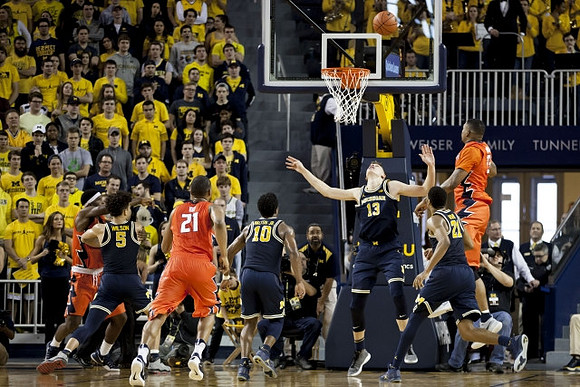 D.J. Wilson (5), Derrick Walton Jr. (10), Moritz Wagner (13), and Zak Irvin (21)
