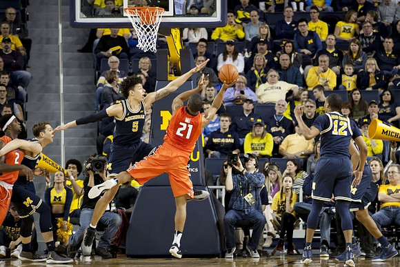 Mark Donnal (34), D.J. Wilson (5), and Muhammad-Ali Abdur-Rahkman (12)
