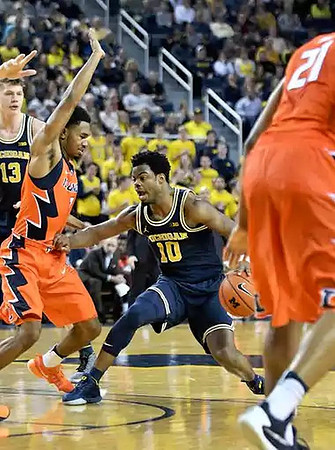Moritz Wagner (13) and Derrick Walton Jr. (10)