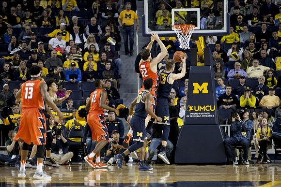 D.J. Wilson (5), Derrick Walton Jr. (10), and Moritz Wagner (13)