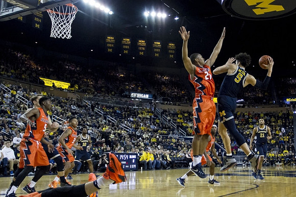 D.J. Wilson (5) and Derrick Walton Jr. (10)
