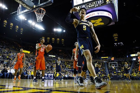 D.J. Wilson (5) and Muhammad-Ali Abdur-Rahkman (12)