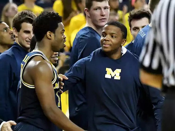Derrick Walton Jr. (10) and Xavier Simpson (3)