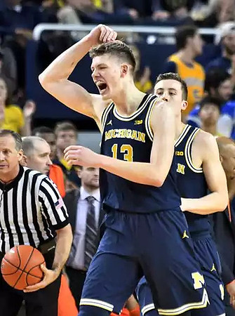 Moritz Wagner (13) and Duncan Robinson (22)