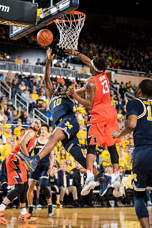 Derrick Walton Jr. (10), D.J. Wilson (5), and Muhammad-Ali Abdur-Rahkman (12)