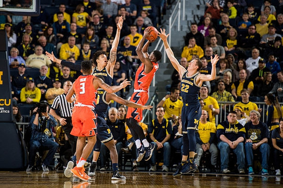 D.J. Wilson (5) and Duncan Robinson (22)