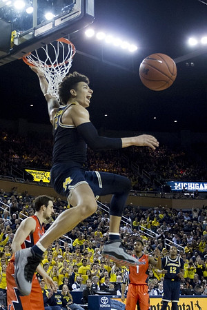 D.J. Wilson (5) and Muhammad-Ali Abdur-Rahkman (12)