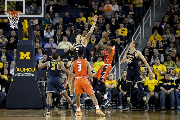 Xavier Simpson (3), D.J. Wilson (5), and Duncan Robinson (22)
