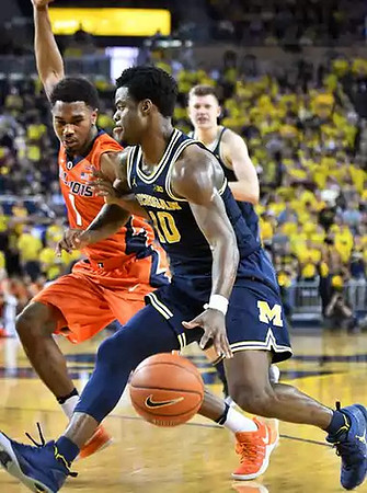 Derrick Walton Jr. (10) and Moritz Wagner (13)