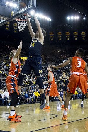 Mark Donnal (34) and D.J. Wilson (5)