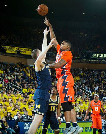Jon Teske (15) and Derrick Walton Jr. (10)