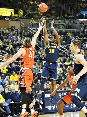 Derrick Walton Jr. (10) and Mark Donnal (34)