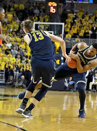 Moritz Wagner (13) and Zak Irvin (21)