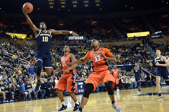 Derrick Walton Jr. (10), D.J. Wilson (5), and Muhammad-Ali Abdur-Rahkman (12)