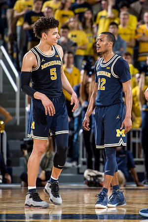 D.J. Wilson (5) and Muhammad-Ali Abdur-Rahkman (12)