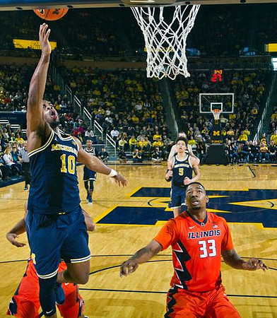 Derrick Walton Jr. (10) and D.J. Wilson (5)