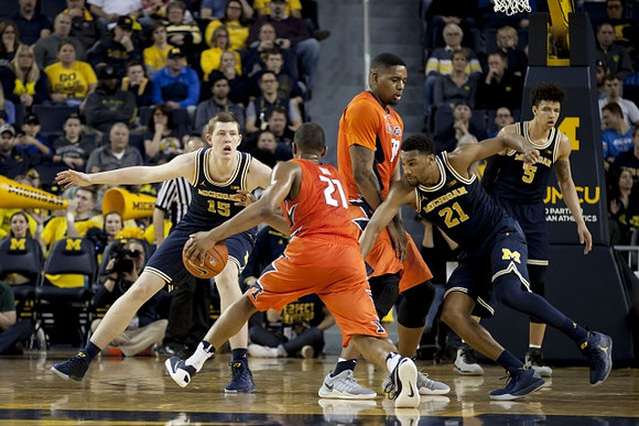 Jon Teske (15), Zak Irvin (21), and D.J. Wilson (5)