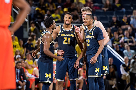 Derrick Walton Jr. (10), Zak Irvin (21), Moritz Wagner (13), and Muhammad-Ali Abdur-Rahkman (12)