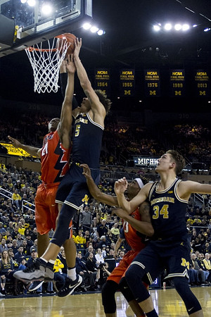 D.J. Wilson (5) and Mark Donnal (34)