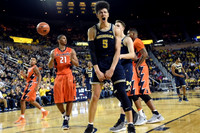 D.J. Wilson (5), Mark Donnal (34), and Derrick Walton Jr. (10)