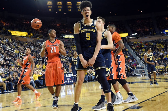 D.J. Wilson (5), Mark Donnal (34), and Derrick Walton Jr. (10)